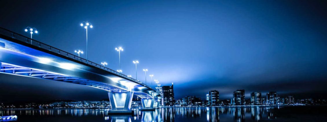 bridge at night with the lights on across river x